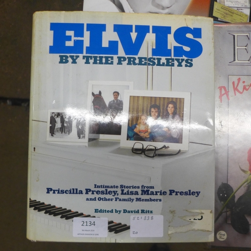 2134 - A quantity of Elvis Presley paraphernalia including books and magazines such as 'Elvis' The Official... 