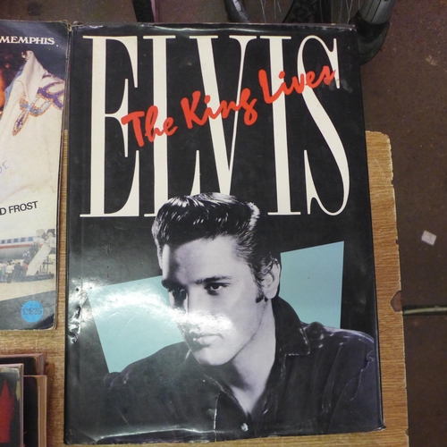 2134 - A quantity of Elvis Presley paraphernalia including books and magazines such as 'Elvis' The Official... 