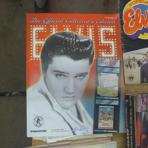 2134 - A quantity of Elvis Presley paraphernalia including books and magazines such as 'Elvis' The Official... 