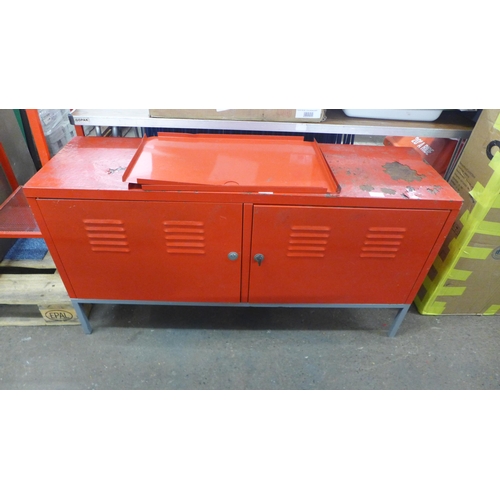 2215 - A red metal two door lockable tool bench (120 x 37 x 63cm)