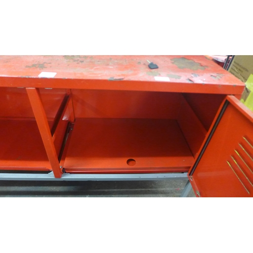 2215 - A red metal two door lockable tool bench (120 x 37 x 63cm)