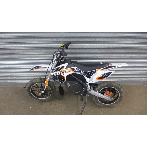 2219 - A Rocket XJE electric off-road mini dirt bike with charger and key - w