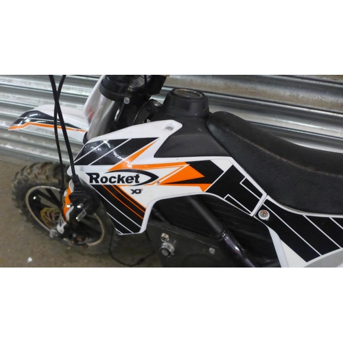 2219 - A Rocket XJE electric off-road mini dirt bike with charger and key - w