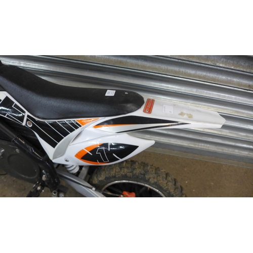 2219 - A Rocket XJE electric off-road mini dirt bike with charger and key - w