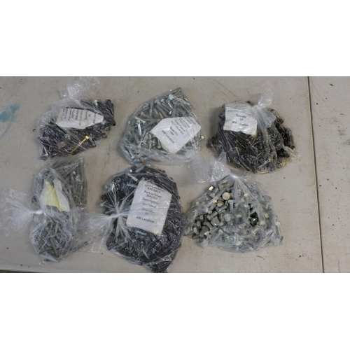 2339 - A large amount of assorted nuts, bolts, electrical connectors and other fixings