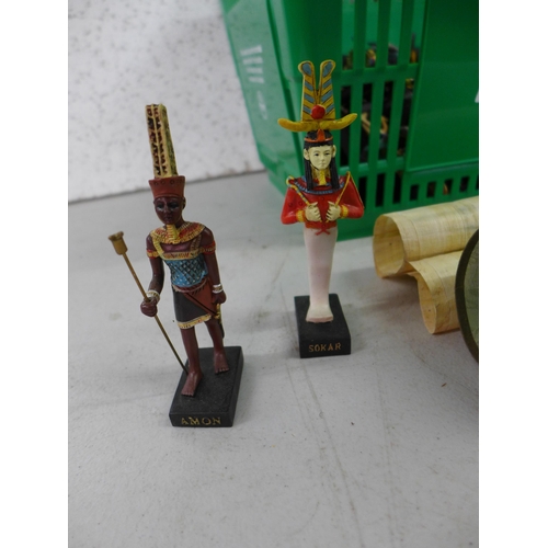 2390 - A quantity of Egyptian figurines and two pieces of Egyptian artwork including papyrus