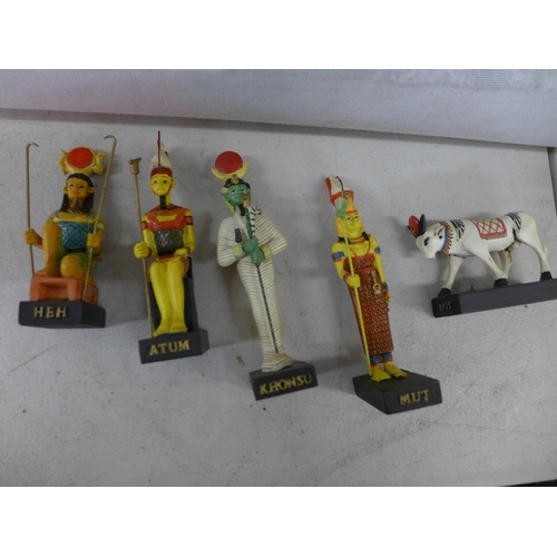 2390 - A quantity of Egyptian figurines and two pieces of Egyptian artwork including papyrus