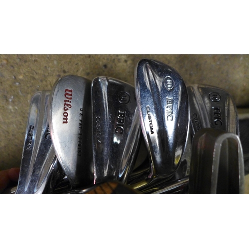 2427 - A quantity of golf clubs including Wilson irons and woods and a Swilken putter