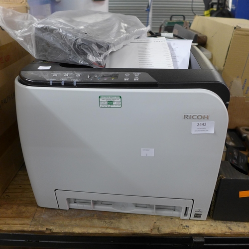 2442 - A Ricoh SP (C250DN) printer with spare cartridge power cable