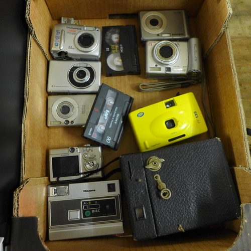 2443 - A box of ten digital cameras, an Alba camcorder, Canon A450, Olympus, Dixons, Samsung, etc.