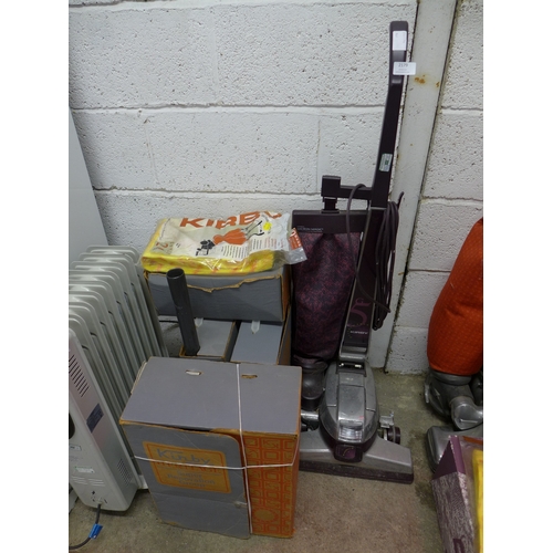 2179 - A Kirby Performance Micron Magic vacuum cleaner with 4 boxes of attachments and spare bags