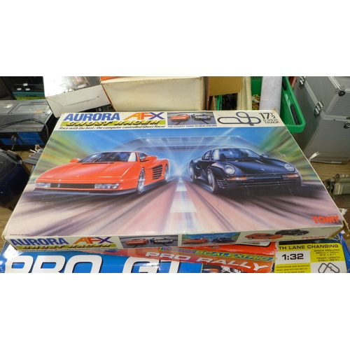 2452 - A collection of Scalextric and other slot racing game sets including Scalextric Digital Pro GT, Micr... 