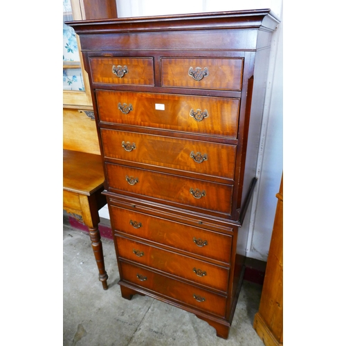 100 - A George III style mahogany chest on chest