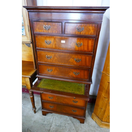 100 - A George III style mahogany chest on chest