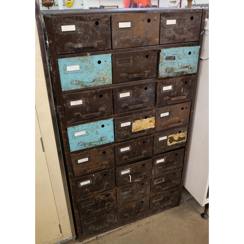 288 - An industrial green metal twenty four drawer cabinet