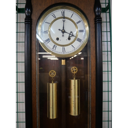 296 - A 19th Century style walnut double weight Vienna wall clock