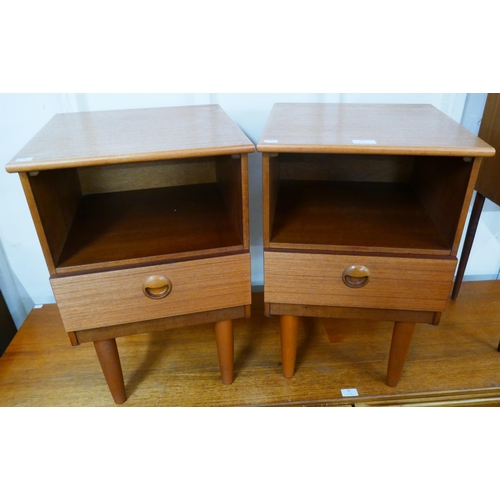 30 - A pair of teak bedside cabinets