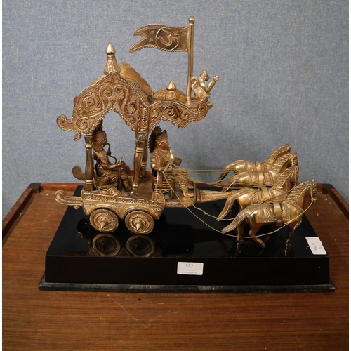 337 - A Far Eastern white metal centrepiece, depicting four horses pulling figures in a carriage