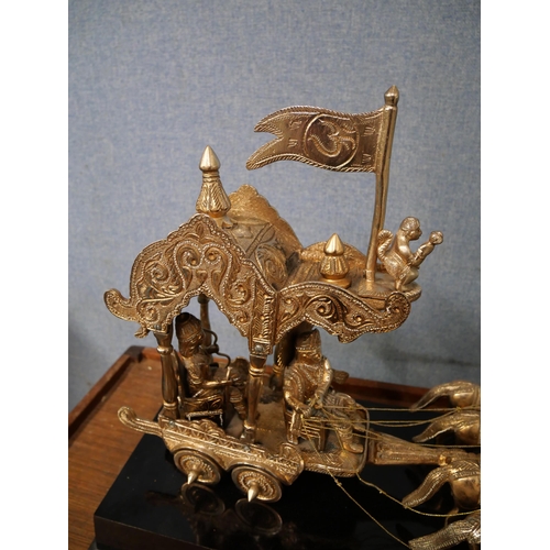 337 - A Far Eastern white metal centrepiece, depicting four horses pulling figures in a carriage