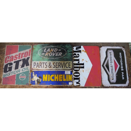 345 - A metal Michelin advertising sign and four other advertising signs