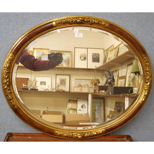 349 - A French style oval gilt framed mirror