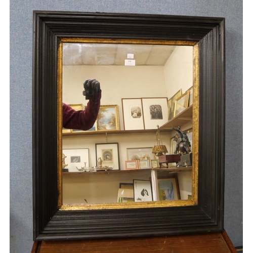 358 - A Victorian style ebonised and parcel gilt framed mirror