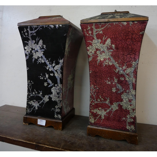 368 - A pair of oriental style black and red lacquered chinoiserie vases and covers