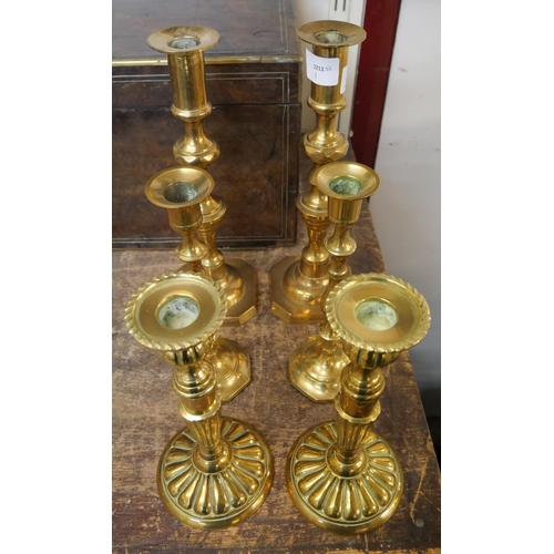 379 - Three pairs of Victorian brass candlesticks