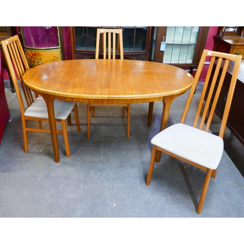 45 - A McIntosh teak extending dining table and three chairs