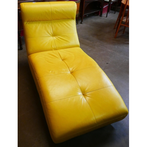 48 - A yellow leather and chrome chaise longue