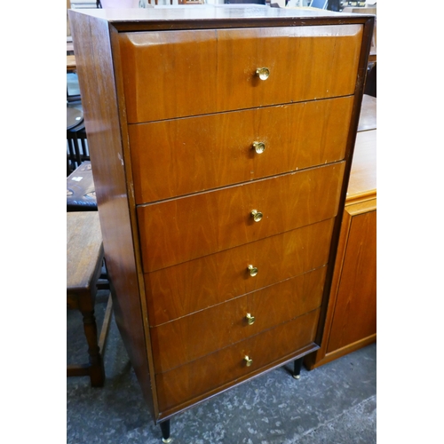 64 - A teak chest of drawers and a dressing table