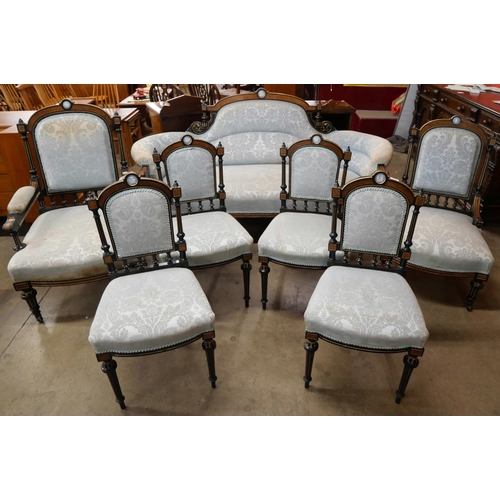 70 - A Victorian ebonised, amboyna and blue fabric upholstered seven piece salon suite, set with Wedgwood... 