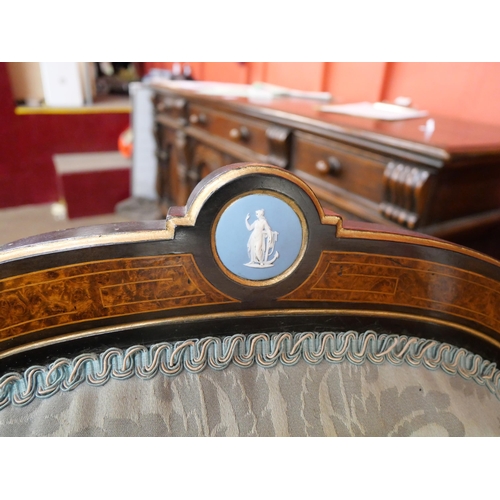 70 - A Victorian ebonised, amboyna and blue fabric upholstered seven piece salon suite, set with Wedgwood... 