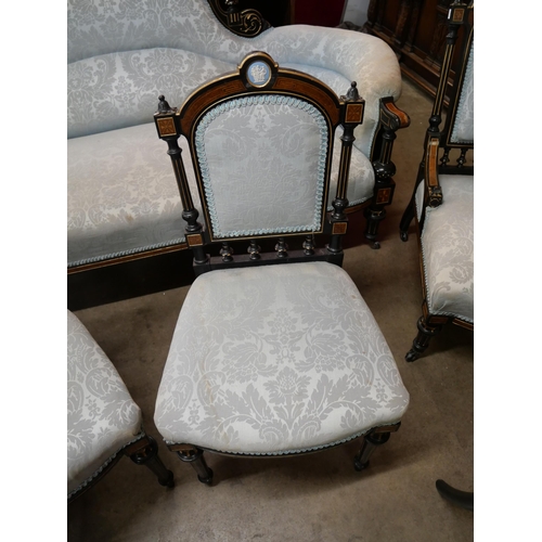 70 - A Victorian ebonised, amboyna and blue fabric upholstered seven piece salon suite, set with Wedgwood... 