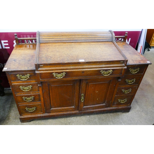 72 - A late Victorian oak tambour roll top bankers desk