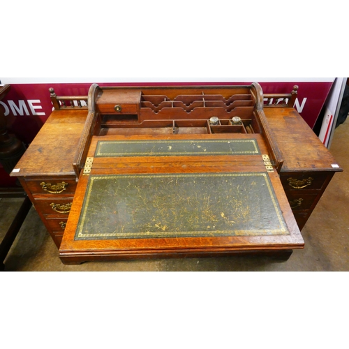 72 - A late Victorian oak tambour roll top bankers desk