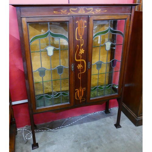 75 - An Art Nouveau inlaid mahogany side cabinet