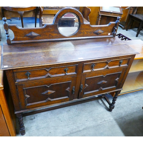 83 - An early 20th Century oak barleytwist mirrorback sideboard