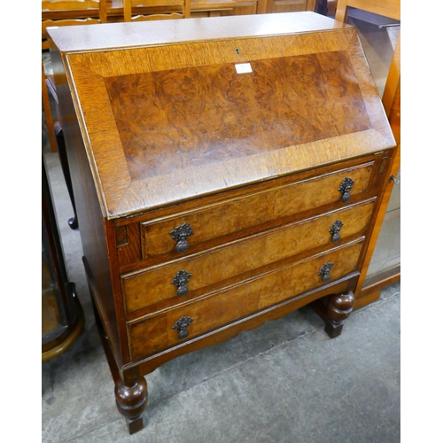 87 - A Queen Anne style oak and burr walnut bureau