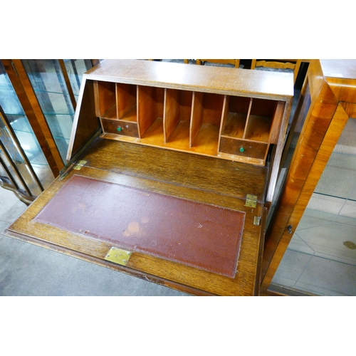 87 - A Queen Anne style oak and burr walnut bureau