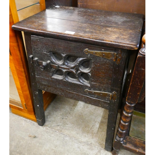 89 - An Elizabethan Revival carved oak credence cupboard