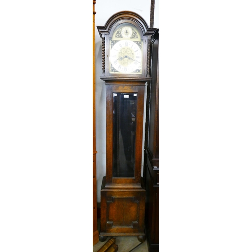 97 - An early 20th Century oak triple weight longcase clock