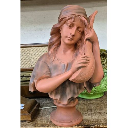 354 - An Art Nouveau style faux terracotta bust of a lady with lute