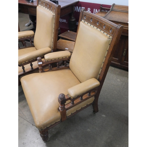 71 - A pair of Victorian Aesthetic Movement carved oak lady's and gentleman's armchairs