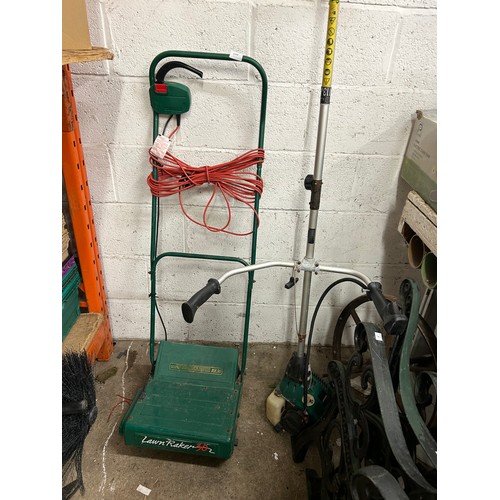 2264 - A Qualcast petrol strimmer (TE30H11032426) and a lawn raker (RE30)