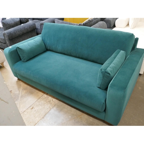 1314 - A turquoise velvet three seater sofa