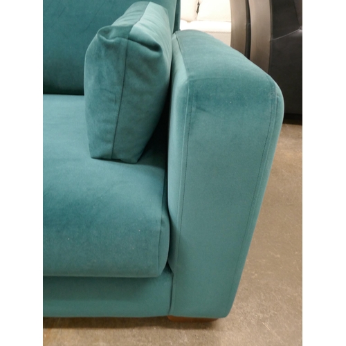 1314 - A turquoise velvet three seater sofa