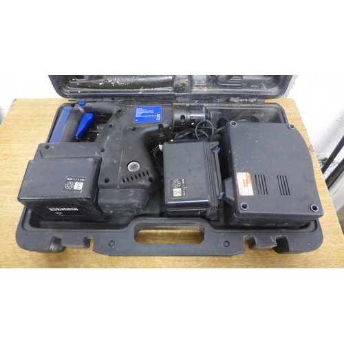 2002 - A Nu Power cordless hammer drill in case (MNCR288) with 2 batteries and battery charger - charger ha... 