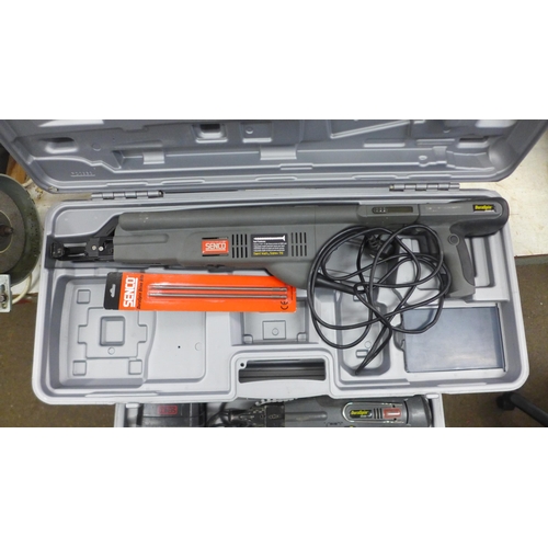 2077 - 2 Boxed power tools; a 14.4v Senco Duraspin auto feed screw gun system (DS250) with battery and char... 