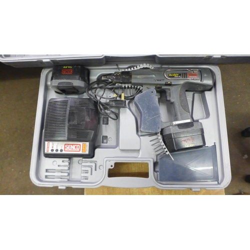 2077 - 2 Boxed power tools; a 14.4v Senco Duraspin auto feed screw gun system (DS250) with battery and char... 